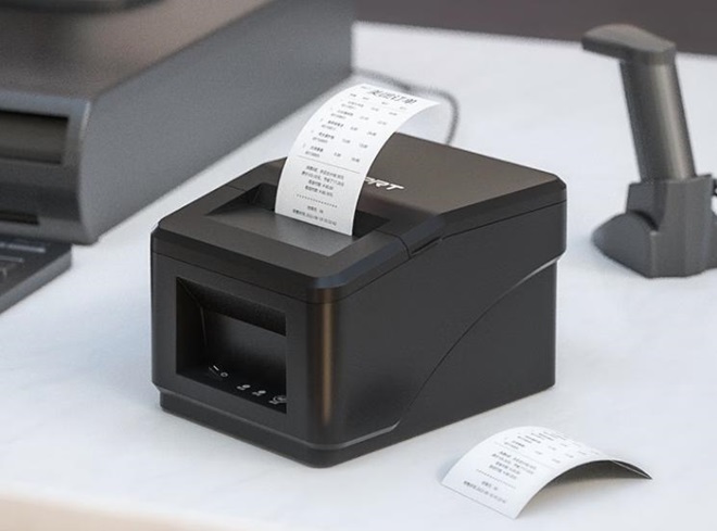 black receipt printer on white table